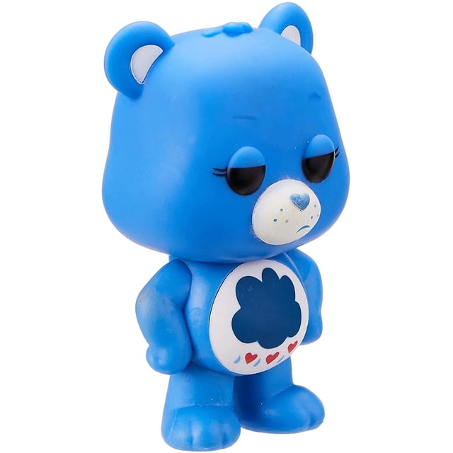 ¡funko pop! animación: figura coleccionable care bears grumpy bear, multicolor Vista frontal de la figura vinilo de 3 3/4 pulgadas: oso azul con cabeza redondeada, orejas pequeñas, hocico blanco con nariz azul y boca hacia abajo, insignia de nube en el pecho con tres corazones rojos; adecuada como adorno de escritorio o pieza de colección en caja con ventana.