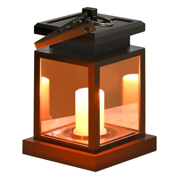 Lámpara solar decorativa para jardín con diseño de vela, iluminación LED cálida y resistente al agua IP54, ideal para patios, cercas y áreas exteriores. Funciona con energía solar, fácil de colgar o