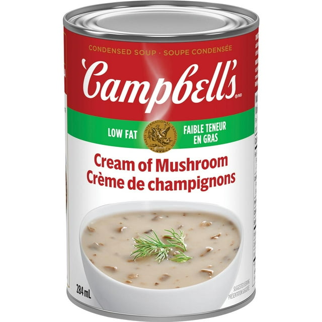 Campbell's® Condensed Low Fat Cream of Mushroom Soup, Shelf Stable, metal can with red and green label featuring the Campbell's logo, low fat claim, and an image of creamy mushroom soup with mushroom pieces and dill garnish in a white bowl, 284 mL, often used to add flavour to recipes or enjoyed as a low-fat soup.