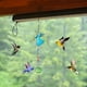 thumbnail image 1 of Alimentador de colibrí pintado con forma de campana de viento, colgante para exteriores, refractor de luz solar, 1 of 5