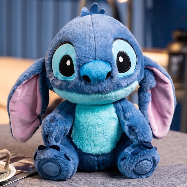 muñeca lilo y stitch, juguete de peluche de disney, muñeca stitch, muñeca de trapo, regalo — peluche Stitch de 33 cm, vista frontal sentado; felpa corta azul oscuro con vientre y rostro turquesa y interior de orejas rosa, ojos bordados negros con borde claro, relleno de algodón PP. Ideal como regalo o adorno de habitación; también suele usarse para exhibir en colecciones de peluches.