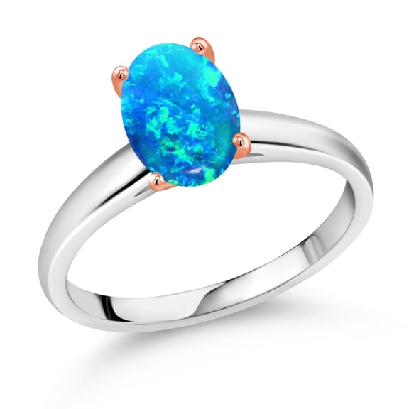 Gem Stone King 0.56 Ct Oval Cabochon Blue Simulated Opal 10K White and Rose Gold Ring (Size 9)