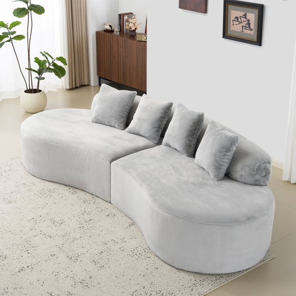 white curved multi - seater sofa. The plush and skin - friendly fabric makes it an excellent choice for modern living room settings.