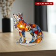 thumbnail image 4 of Rotating acrylic ornament features colorful glass fragments forming a decorative wolf glowing brilliantly in sunlight against a pure white background, 4 of 8