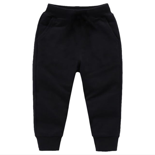 Splozh Baggy Sweatpants for toddler boys and girls, ages 18-24 months. These black pull-on jogging pants feature a loose fit, solid pattern, elastic waistband, and bow detail. Made from a cotton blend for winter warmth and soft comfort. Perfect for baby boy bottoms, casual wear, outdoor activities, or photoshoots.