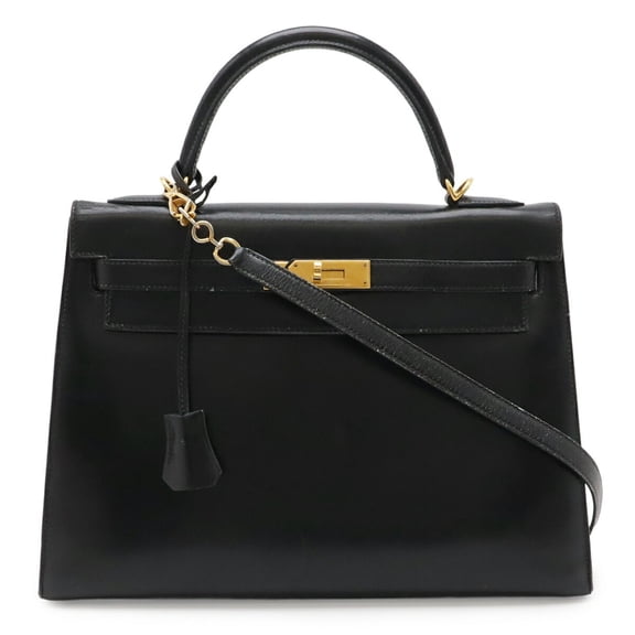 Pre-Owned HERMES Kelly 32 handbag, external stitching, box calf leather, black, with "T" stamp.
