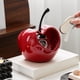 thumbnail image 5 of Adorno de Manzana de Cerámica con Forma de Corazón | Decoración Navideña Roja con Tallo de Metal Plateado o Negro | Llavero para Recibidor | Decoración Navideña Moderna para Sala de Estar, 5 of 6