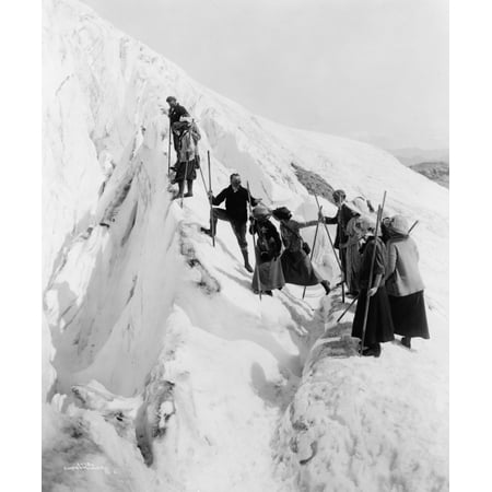 Group Of Men And Women Climbing Paradise Glacier In Mt Rainier National Park