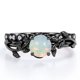 thumbnail image 1 of JeenMata Anillo Nupcial con Diseño de Hoja de Rama de Moissanita y Ópalo de Fuego Redondo de 0,65 Quilates Engastado en Solitario con Garras en Baño de Oro Negro de 18 K sobre Plata, 1 of 6