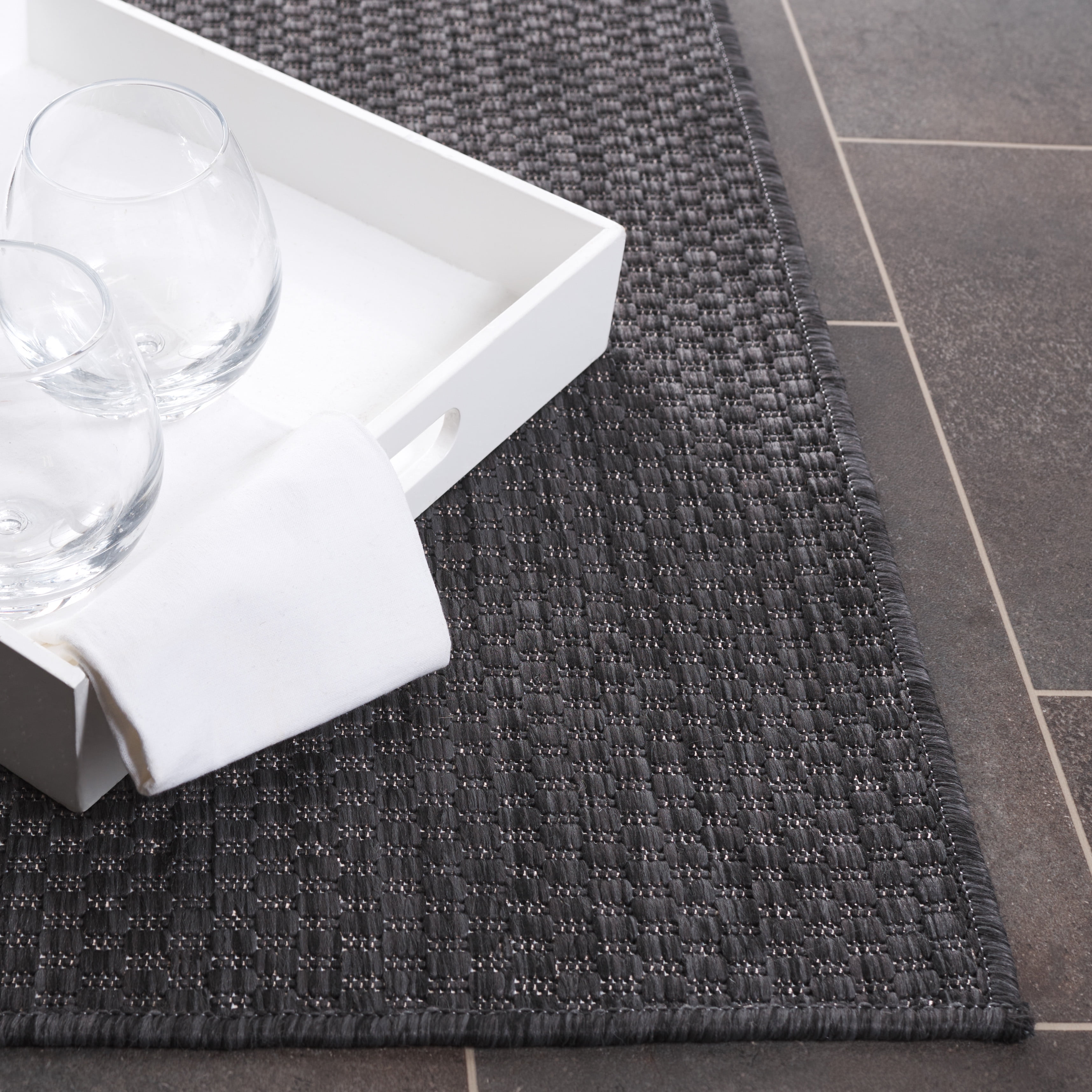 SAFAVIEH Beach House Jacinth Solid Indoor/Outdoor Area Rug, Black, 9' x 12'