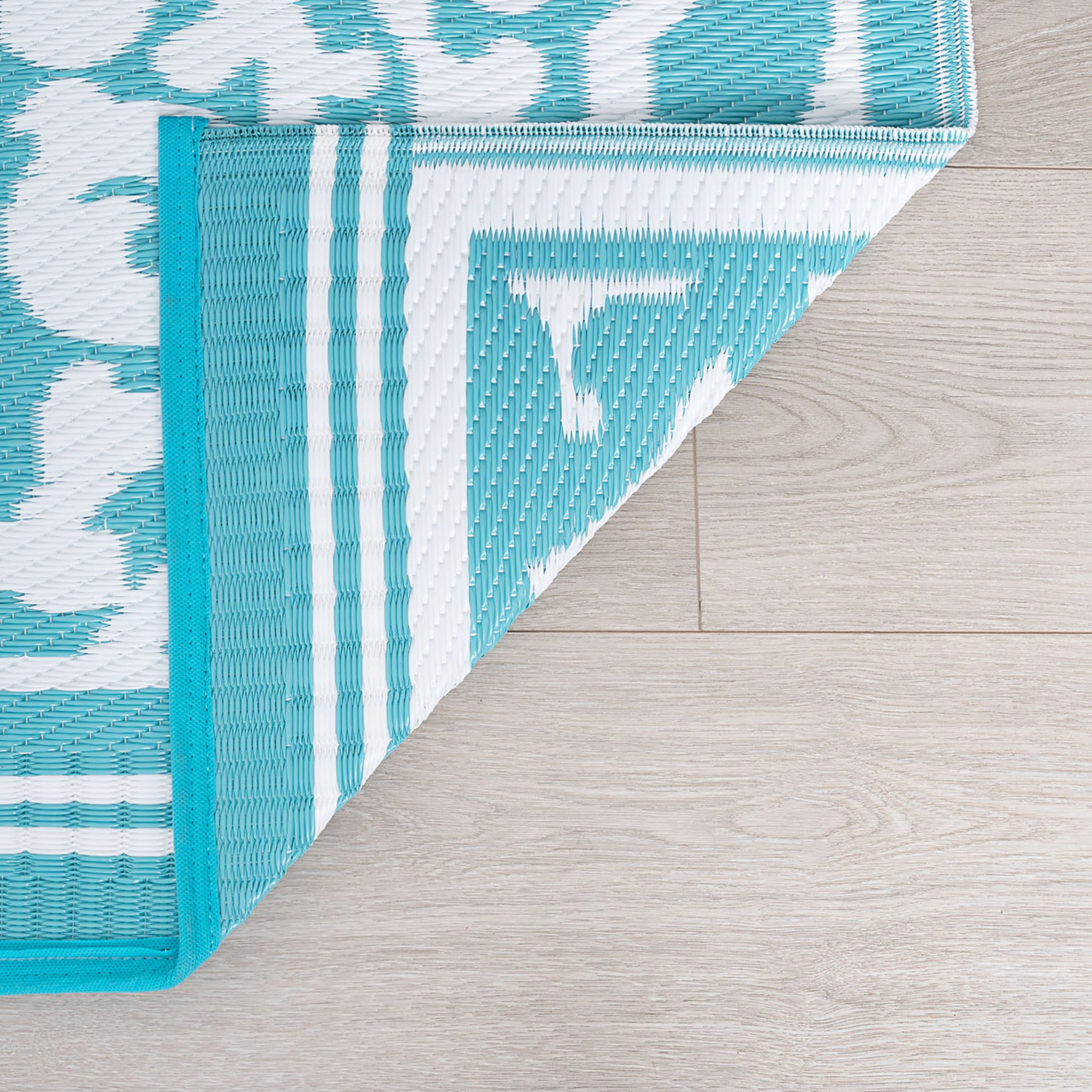 5x7 Reversible Aqua and White Polypropylene Outdoor Damask Area Rug