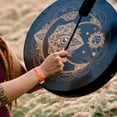 thumbnail image 4 of Golden Moon-Eyed Hand Drum: 2024 Artisanal Percussion Instrument with Lunar Design, Handcrafted for Festive Decor & Musical Performance – Elegant Gold Finish, Durable Craftsmanship, Versatile, 4 of 5