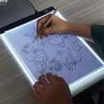 thumbnail image 4 of Tablero de Dibujo para Niños A4 con 3 Niveles de Brillo Ajustable, Luz LED, Mesa de Copia y Dibujo, 4 of 8