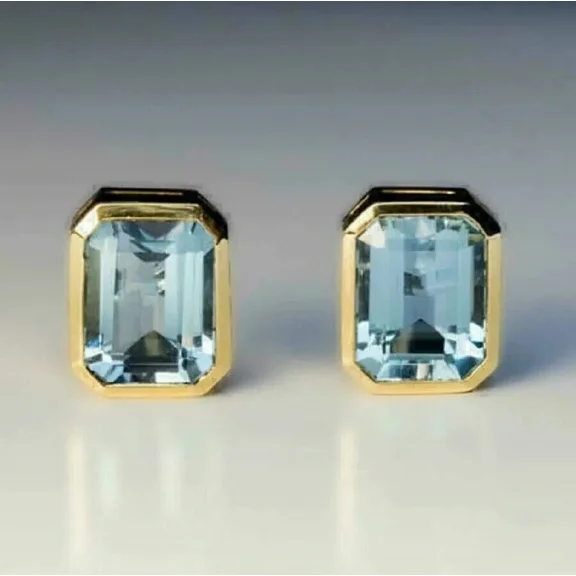 3TCW Emerald Cut Lab Created Aquamarine Bezel Set Stud Earrings 14K Yellow Gold Plated