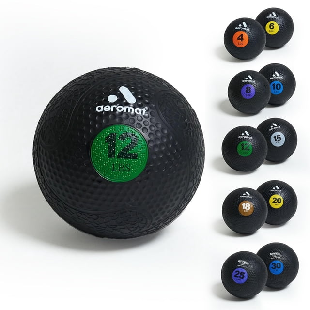 balón medicinal aeromat extreme elite, 5,4 kg (12 libras), color verde — balón medicinal negro con medallón circular verde que indica "12 LBS", superficie de goma texturizada con relieve de puntos, logotipo Aeromat en blanco y patrón grabado; fondo blanco con columna que muestra otras variantes por peso y color; adecuado para ejercicios de core y entrenamiento funcional, y a menudo usado para acondicionamiento general y trabajo de estabilidad.