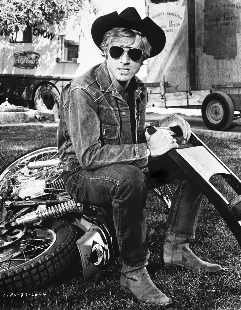 Robert Redford wearing a cowboy hat on a motorcycle Photo Print (24 x