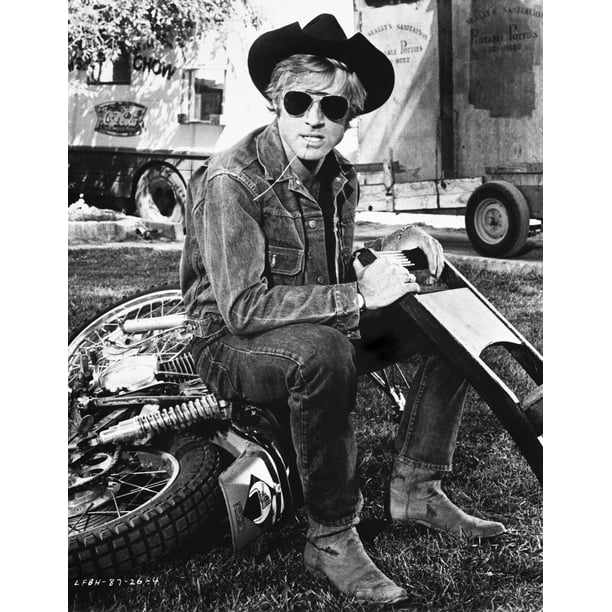 Robert Redford wearing a cowboy hat on a motorcycle Photo Print (24 x