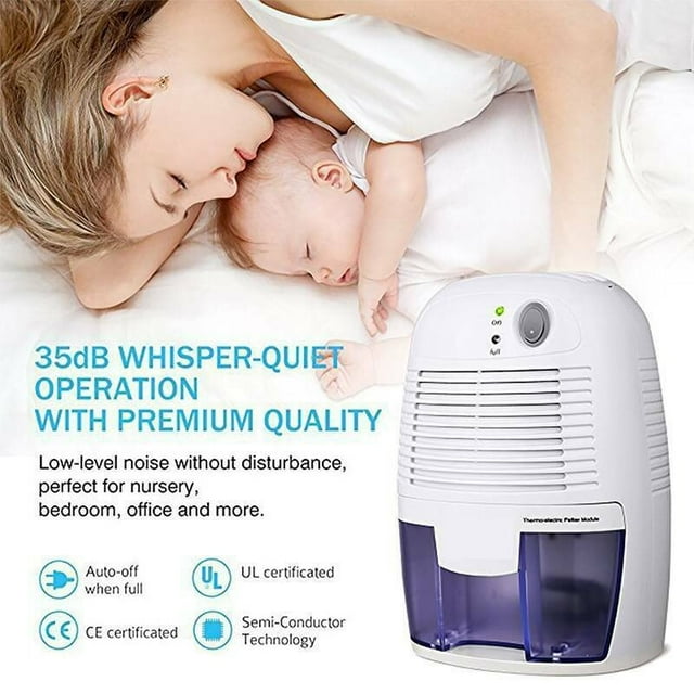 deshumidificador y purificador de aire SANLIN BEANS 500 ml con humidistato, vista frontal 3/4 de unidad blanca con rejillas superiores, indicador LED y depósito transparente morado extraíble de 500 ml; situado en fondo tipo dormitorio que sugiere uso en habitaciones pequeñas, armarios y trasteros; portátil, silencioso y con apagado automático al llenarse el tanque; también suele usarse para proteger ropa y textiles almacenados.