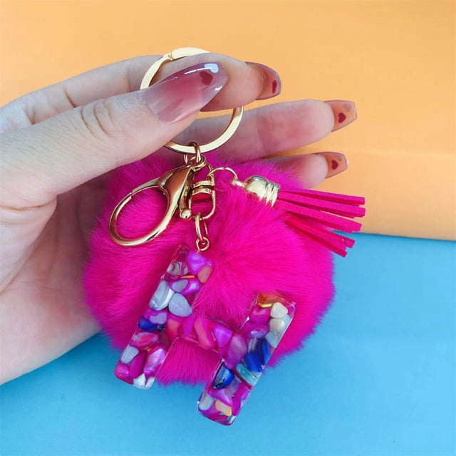 Llavero con forma de bola de pelo de color rojo rosa y letras de resina epoxi