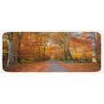 thumbnail image 1 of Fall Kitchen Mat, Pathway Covered Fallen Leaves Through Autumn Forest Vibrant Trees Print, Plush Decorative Kitchen Mat with Non Slip Backing, 47" X 19", Orange Yellow Green, by Ambesonne, 1 of 1