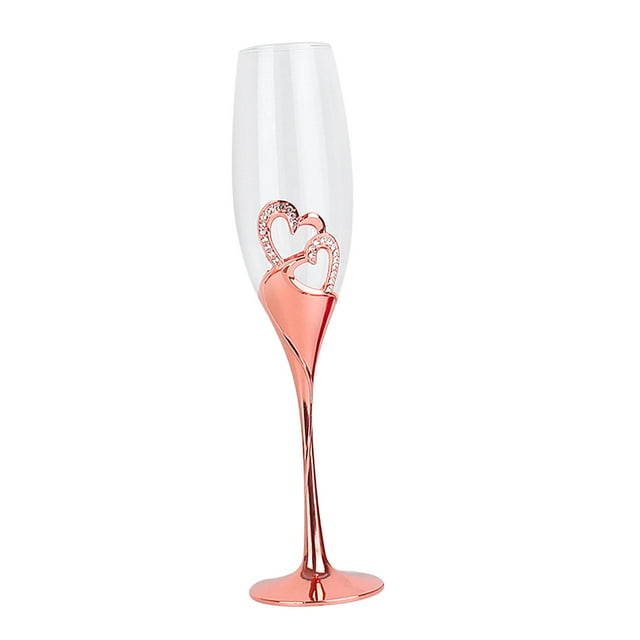 copas de champán de tallo largo sopladas a mano, elegante copa en forma de corazón para brindis rosa áurea 26 cm. Vista frontal centrada de una flauta con cáliz de cristal transparente y tallo y base metálicos rosa áurea; el cuerpo tiene una incrustación en forma de corazón con adorno brillante. Para bodas y servicio de catering; también suele usarse como centro de mesa decorativo.