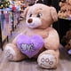 thumbnail image 3 of Pelucheria Oso Rechoncho Beige LOVE con corazon Morado, 3 of 5