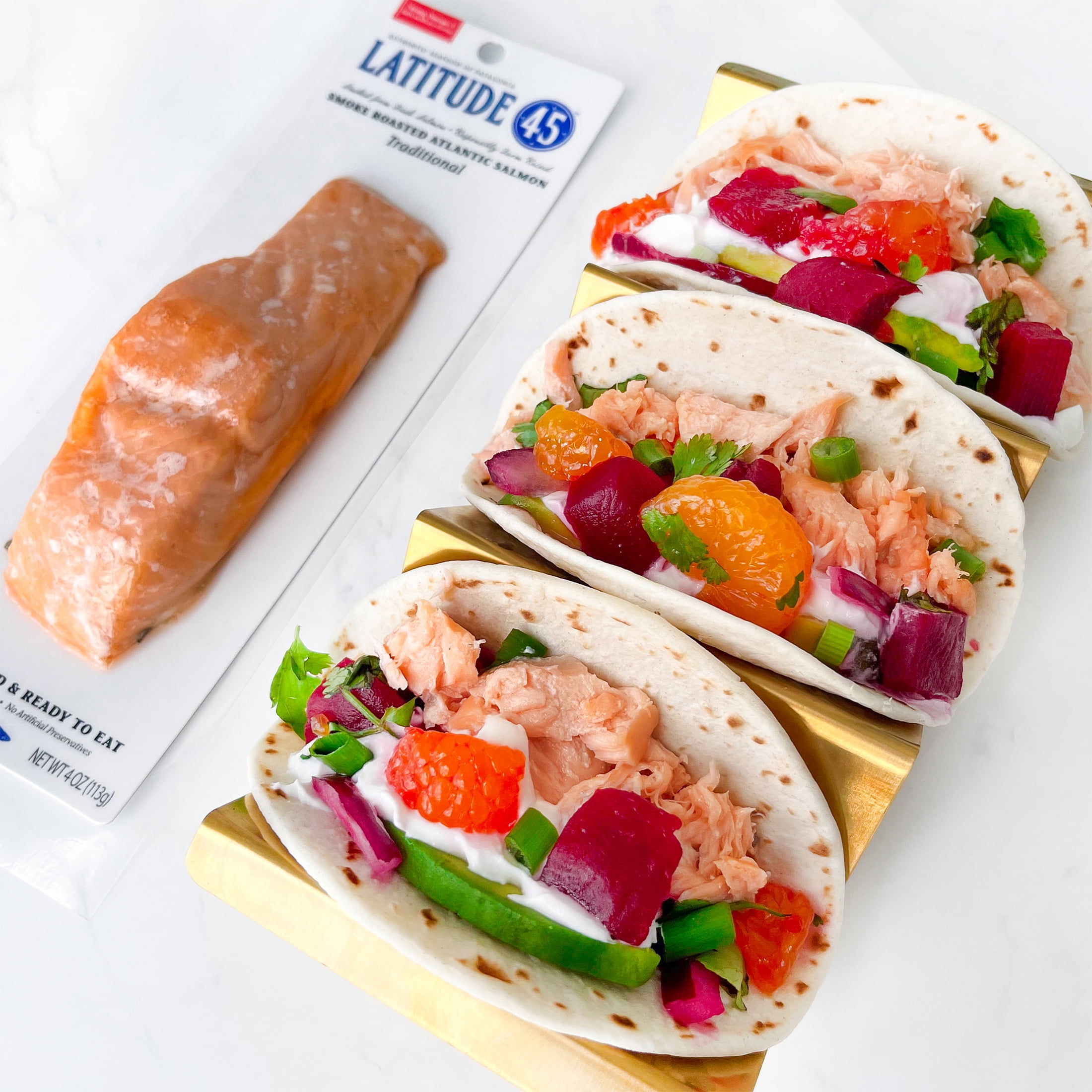 Latitude 45 Roasted Smoked Atlantic Salmon, 4oz package, 2 servings per container, serving size 2oz, 12g protein per serving.