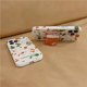 thumbnail image 2 of Funda navideña compatible con iPhone 14, diseño navideño con estampado geométrico rojo y verde, con calcetines navideños de dibujos animados, Pop Socket para mujeres y niñas., 2 of 8
