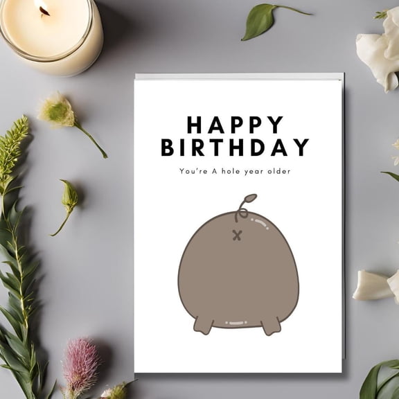 Funny Birthday Card – "Happy Birthday, You’re A Hole Year Older" with Cute Character – Blank Inside, Envelope Included – Perfect for Friends and Family Celebrations
