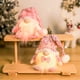 thumbnail image 1 of Muñeco Anciano Gnomo Brillante y Sin Rostro de Navidad | Sombrero rosa de punto peludo | Sombrero flexible ajustable | Decoración navideña con luz cálida | Decoración familiar escandinava de 15,56, 1 of 6