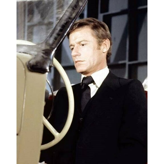 Roddy McDowall in suit and tie sits at wheel of vintage car 8x10 inch photo