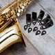 thumbnail image 1 of Homoyoyo 5Jgo Saxophone Thumb Support Negro Manos Saxofón Práctica Uso Fácil, 1 of 8