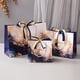 thumbnail image 2 of Juego de bolsas de regalo de mármol dorado azul con cinta, paquete de 3, 2 of 4