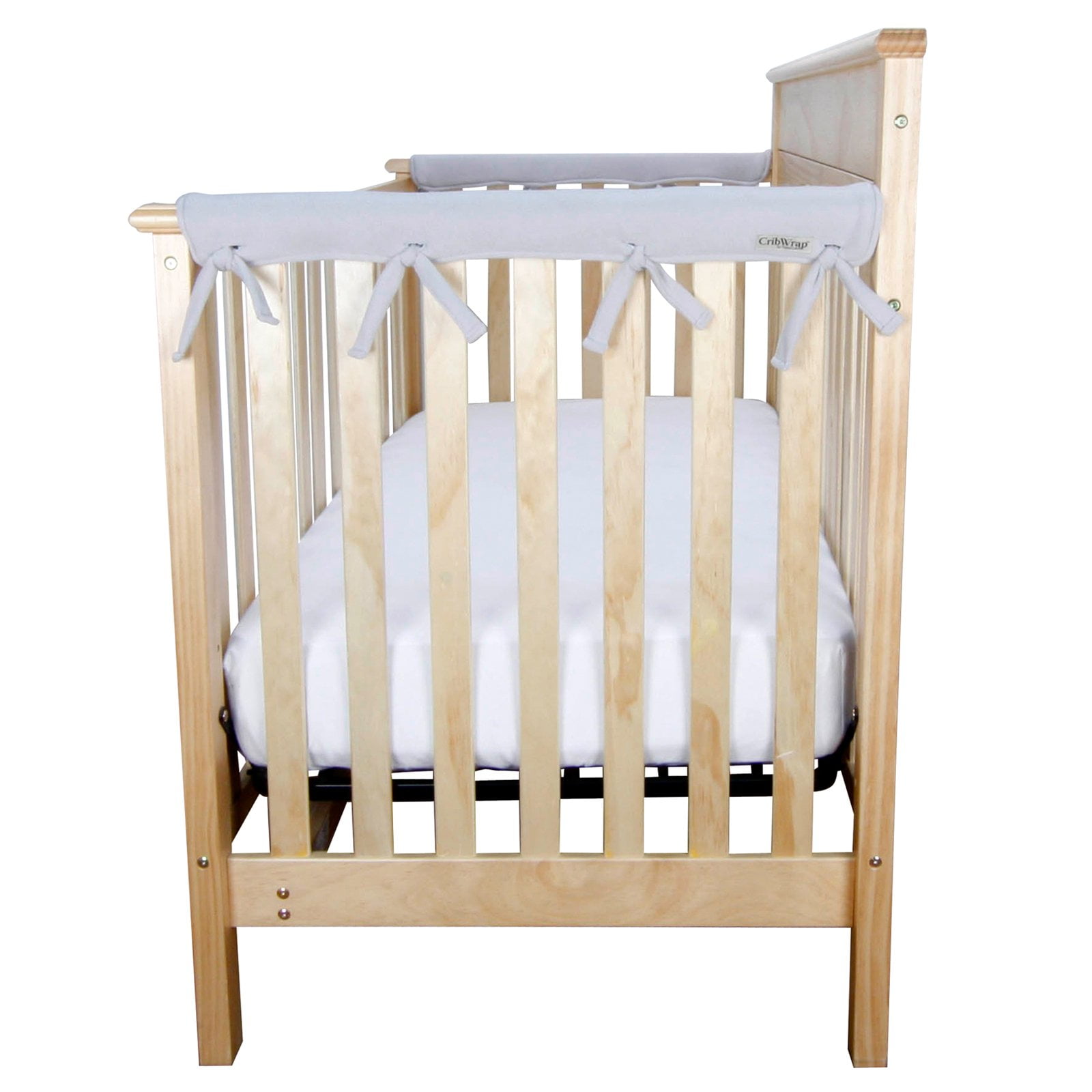 white crib with wood x on side