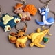 thumbnail image 2 of LLavero de coche de Pokémon, figura de acción de Pikachu, Squirtle, Psyduck, modelo, mochila, colgante, regalos, 2 of 5