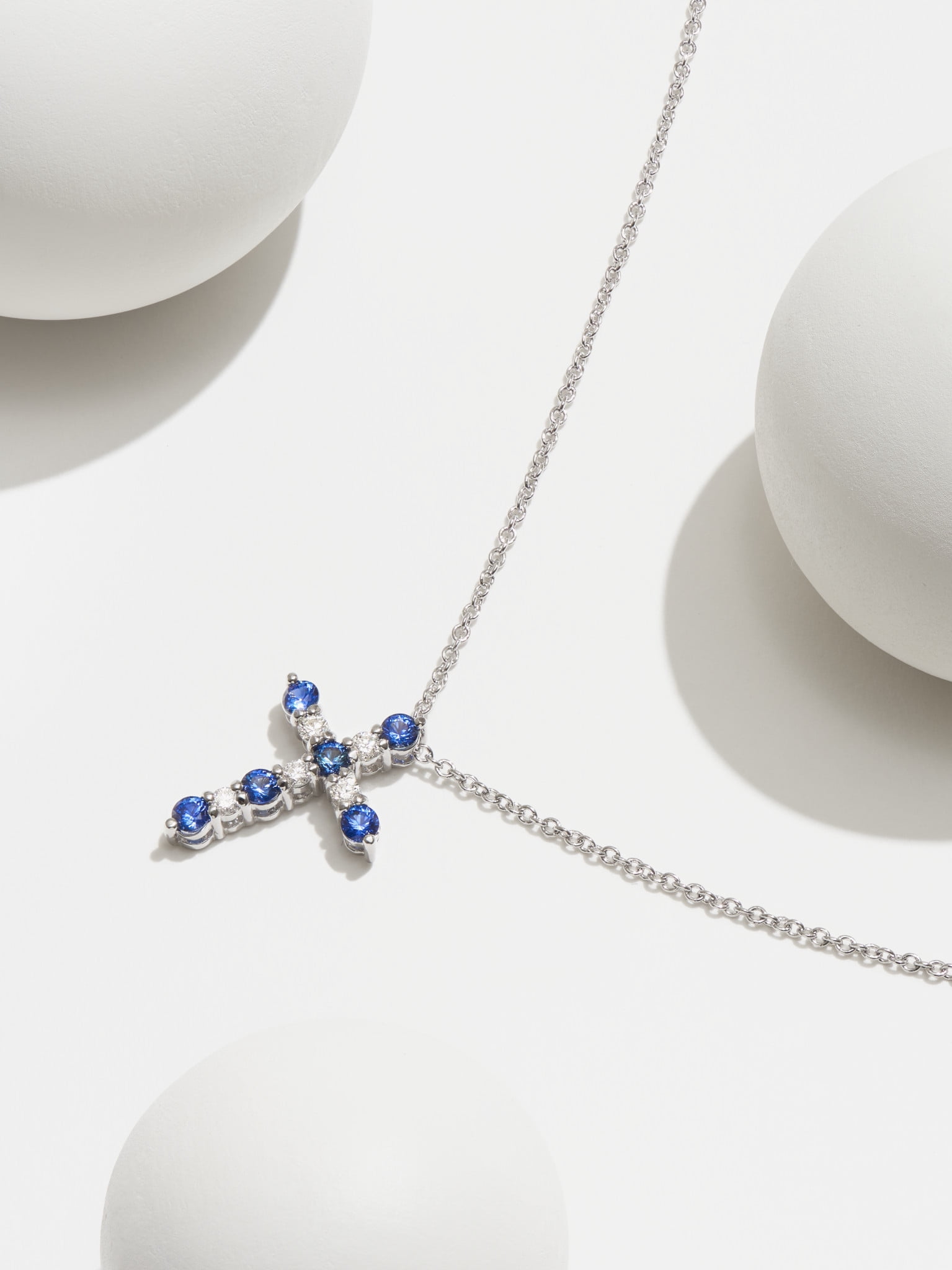 Forever Facets Jewelry Platinum Over Sterling Silver Created Blue Sapphire and 1/8th Carat Total Weight Lab Grown Diamond Cross Necklace, 18" Cable Chain with 2" Extender (H-I Color, I1 Clarity)