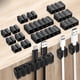 thumbnail image 2 of Organizador de Cables de silicona, Clip autoadhesivo para gestión de cables, cargador, mesa de noche y compartimentos, color negro, 2 of 5