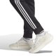 thumbnail image 3 of Pantalones deportivos adidas Essentials de forro polar con 3 rayas para hombre, color negro y blanco, 3 of 5