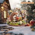 thumbnail image 1 of Rotating acrylic ornament featuring a colorful hedgehog enjoying an apple amidst detailed grass and vibrant flowers. Perfect decorative piece, 1 of 7