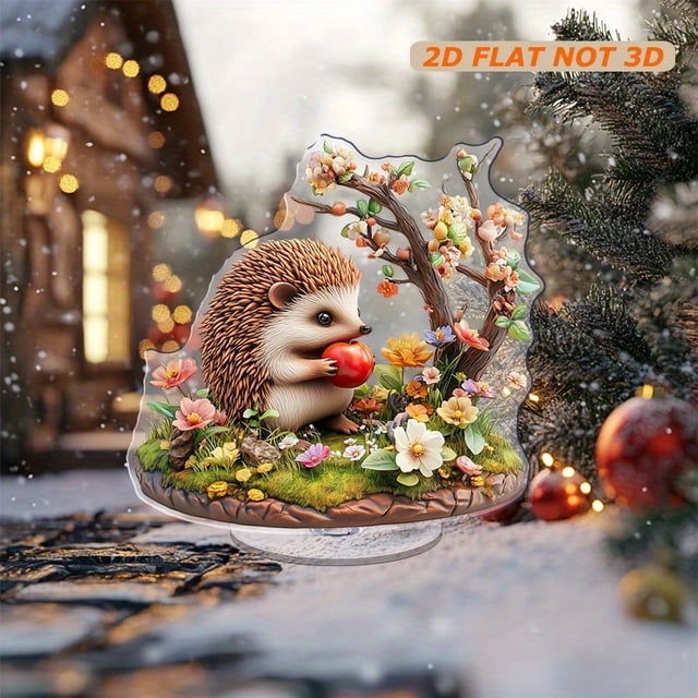 Rotating acrylic ornament featuring a colorful hedgehog enjoying an apple amidst detailed grass and vibrant flowers. Perfect decorative piece