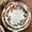 White, variant on BrylaneHome 16 Piece Christmas Dinnerware Set (Service for 4), Includes Dinner & Salad or Dessert Plates, Bowls, Mugs, Red & Green Holly & Holiday Ribbon Pattern