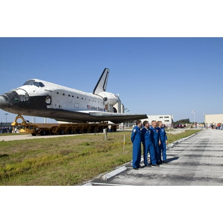 - LAMINATED POSTER The STS-135 crew members pose for a photo in front of shuttle Atlantis, which is making its final pl Poster Print 24 x 36
