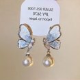 thumbnail image 1 of Pendientes de flor de mariposa de cristal azul degradado con aguja plateada, pendientes de verano pequeños y frescos con temperamento, pendientes dulces de moda, 1 of 6