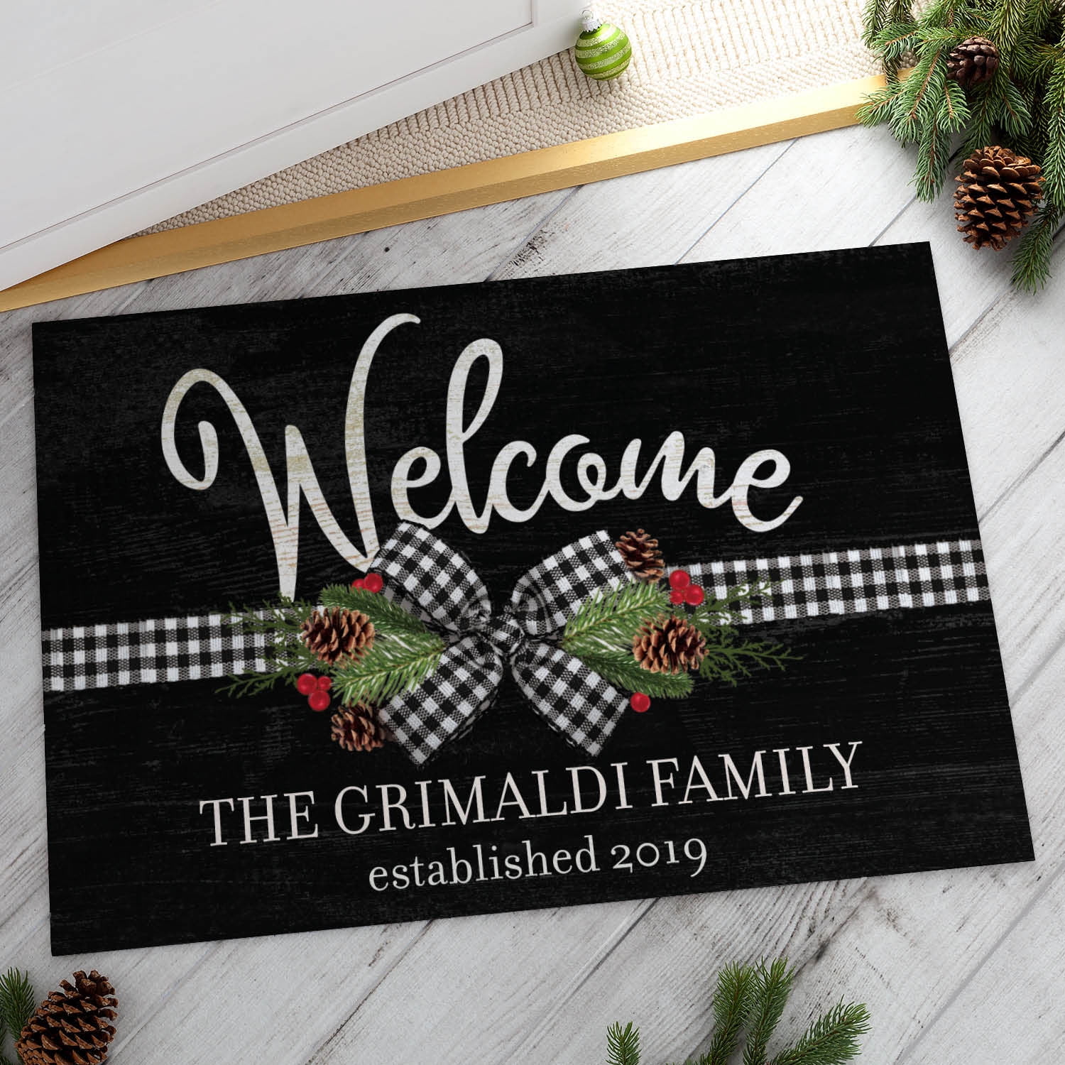 Personalized Planet 27x18 Plaid Christmas Bow and Pine Welcome Doormat with Custom Personalization Printed on Black Rectangular 1/8” Thick Non Slip Mat for Kitchen Hallway Deck or Porch