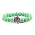 thumbnail image 1 of Pulsera con dije de huella de pata de piedra volcánica de lava negra mate natural, ideal como recuerdo para mascotas, amantes de los gatos y los perros., 1 of 2