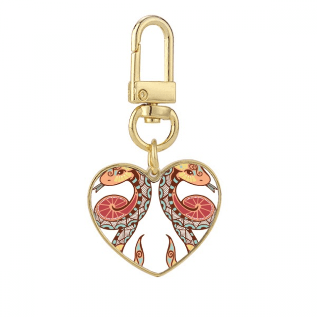 La constelación de Gemini simbolo de Zodiaco Llavero de metal en forma de corazón dorado