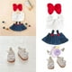 thumbnail image 2 of Ropa para muñecas (muñeca no incluida) Incluye camisa blanca con encaje + peto vaquero con botones rojos + falda + lazo rojo + cámara morada + zapatos blancos (conjunto de cinco piezas), 2 of 7