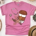thumbnail image 1 of Nurse Graphic T-Shirt with Coffee Cup and Stethoscope Design, Heliconia, Size M, 1 of 6