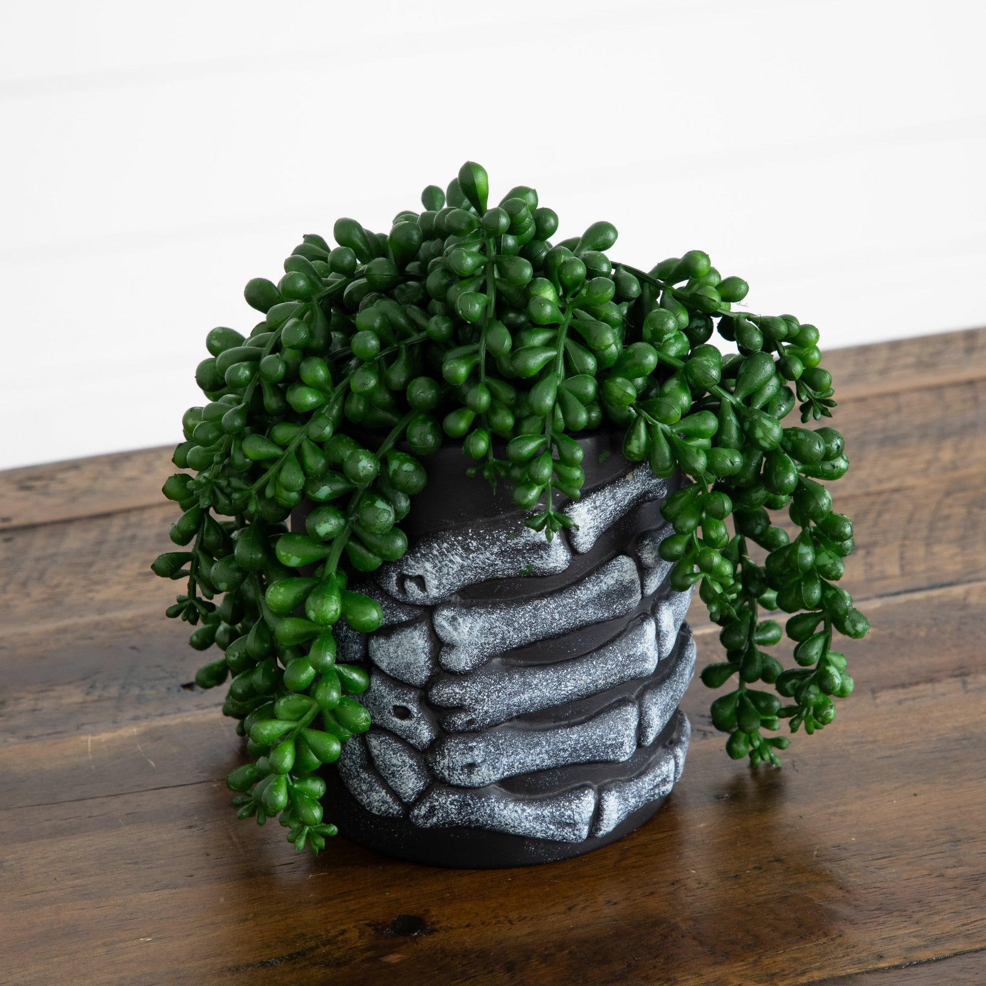 7in. Artificial Halloween String of Pearls in Skeleton Hand Planter
