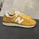 thumbnail image 1 of New Balance 574 Mens 10 Yellow ML574PJ2 Athletic Sneakers, 1 of 6